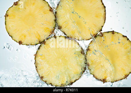 Pineapple Water Splash on White Baclground Stock Photo