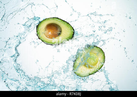 Avocado Water Splash on white background Stock Photo