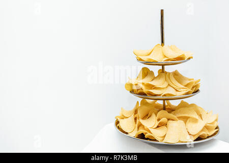 Chips texture crisp potato background of golden unhealthy food . Stock Photo