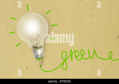 Light bulb with green pencil on recycled paper - Ecology and creativity concept Stock Photo