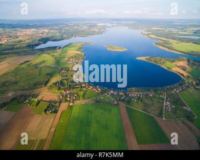 Aerial view of beautiful Kal village (former Kehlen or Kielno, East Prussia) located on Swiecajty Lake shore, Mazury, Poland Stock Photo