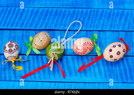 Painted Easter eggs on the blue table Stock Photo