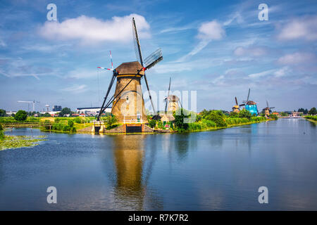 view of traditional windmills in Kinderdijk, The Netherlands. This system of 19 windmills was built around 1740 and is a UNESCO heritage site. Stock Photo
