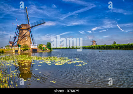 view of traditional windmills in Kinderdijk, The Netherlands. This system of 19 windmills was built around 1740 and is a UNESCO heritage site. Stock Photo