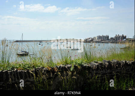 Barmouth town and harbour on the estuary of the river Mawddach and Cardigan Bay, the marina and quay in Gwynedd, North Wales, UK. Stock Photo