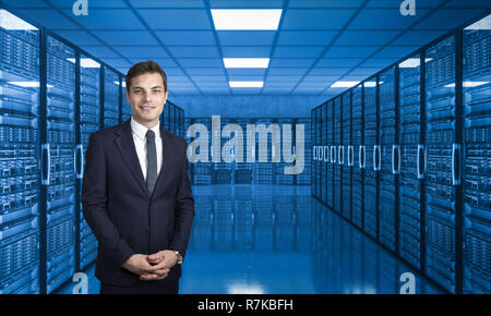 smiling businessman in server data center Stock Photo