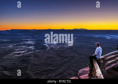Tourist at the Green River Overlook in Canyonlands National Park Stock Photo
