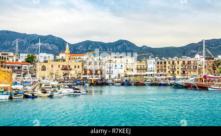 Kirenia historical city center, view to marina with many yachts and boats and mountains in the background, North Cyprus Stock Photo