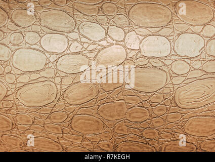 Artificial crocodile or python golden skin texture background. Stock Photo