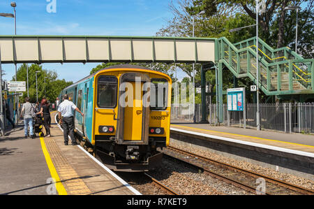 People catching a train at Llantwit Major railway station in the Vale of Glamorgan, Wales Stock Photo