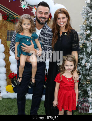 Los Angeles, USA. 9th Dec 2018. Sailor Stevie Swisher, Nick Swisher,  Emerson Jay Swisher and JoAnna Garcia Swisher arrive at the Brooks Brothers  Annual Holiday Celebration In Los Angeles To Benefit St.