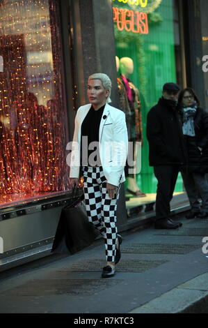 Milan, Italy. 10th December 2018. Rodrigo Alves shopping center Rodrigo Alves, the 'human Ken', surprised walking through the streets of downtown while doing some shopping. Here he is while he visits the 'GUCCI' boutique in via Montenapoleone, then a car arrives that will take him back to the hotel. Credit: Independent Photo Agency Srl/Alamy Live News Stock Photo