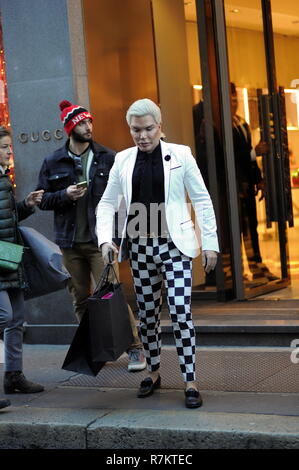 Milan, Italy. 10th December 2018. Rodrigo Alves shopping center Rodrigo Alves, the 'human Ken', surprised walking through the streets of downtown while doing some shopping. Here he is while he visits the 'GUCCI' boutique in via Montenapoleone, then a car arrives that will take him back to the hotel. Credit: Independent Photo Agency Srl/Alamy Live News Stock Photo