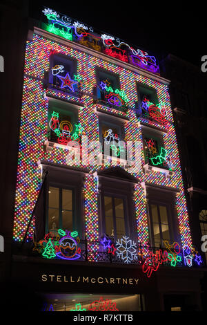 London, UK. 10th December 2018. A view of the exterior of the  new flagship store by fashion designer Stella McCartney in Old Bond Street  is lit  up in Christmas decorations Credit: amer ghazzal/Alamy Live News Stock Photo
