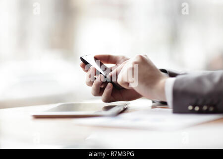 close up.businessman presses his finger on the screen of the sma Stock Photo