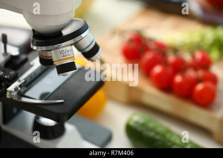 Microscope head on kitchen background Stock Photo