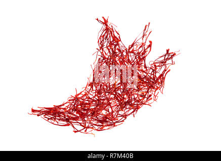 Saffron's silhouette of the crocus. Delicate saffron threads, plucked from crocus flowers and dried. Isolated on white background. Stock Photo