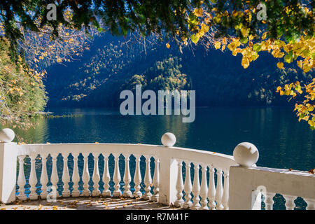 white railing of the estate on the river Bank Stock Photo
