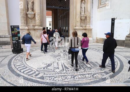 COIMBRA, PORTUGAL - MAY 26, 2018: Tourists visit Coimbra University in Portugal. The university is a UNESCO World Heritage Site. Stock Photo