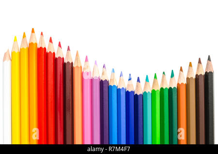 Closeup of coloured pencils lined up in a row. Stock Photo