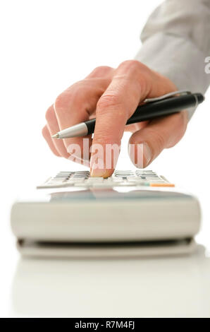 Closeup of male hand using calculator. Stock Photo
