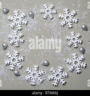 White Snowflakes on Beige Background, Winter Concept, Top View Stock Photo