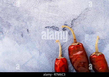 Dry red peppers on table with copy space, top view Stock Photo