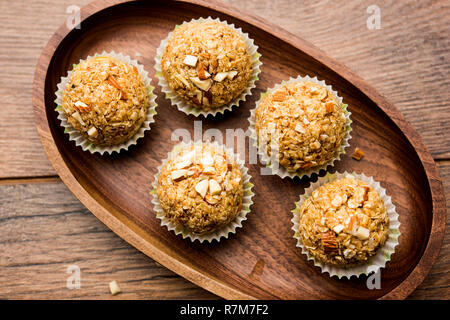 Oats laddu or Ladoo also known as Protein Energy balls. served in a plate or bowl. selective focus Stock Photo