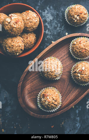 Oats laddu or Ladoo also known as Protein Energy balls. served in a plate or bowl. selective focus Stock Photo