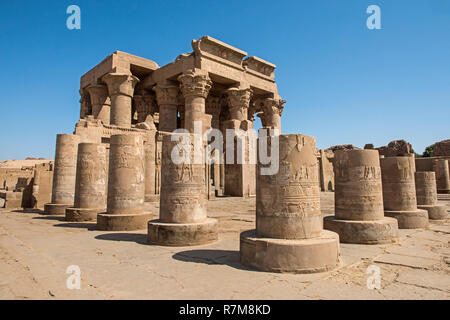 Pillars columns and wall at the entrance to ancient egyptian temple of Kom Ombo Stock Photo