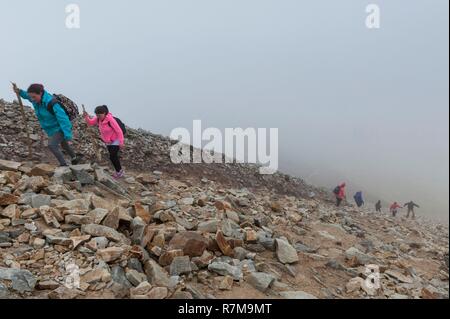 Republic of Ireland, County Mayo, Murrisk, Pilgrims climbing Croagh Patrick mountain Stock Photo