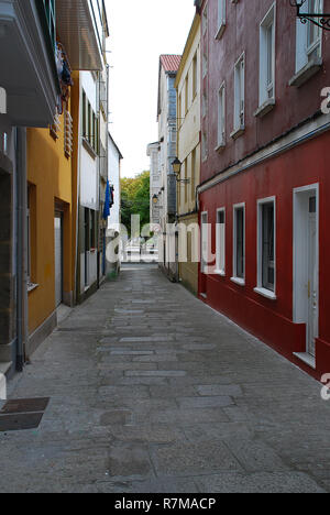 A narrow street in Ferrol. Ferrol  is a city in the Province of A Coruna in Galicia, located on the Atlantic coast in north-western Spain. Stock Photo
