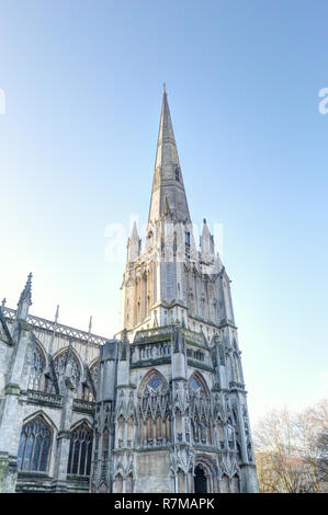 The Gothic and Reinassance Saint Mary Redcliffe Church bell tower with pointed roof and steeples, during a sunny winter day in Bristol, United Kingdom