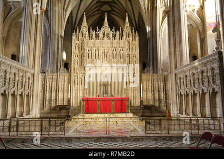 The main altar in the central nave of the Bristol Cathedral, with pointed arches and Gothic decorations in South West England, United Kingdom Stock Photo