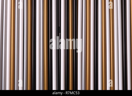 A set of straws of multicolored plastic tubes of unusual colors for the background Stock Photo