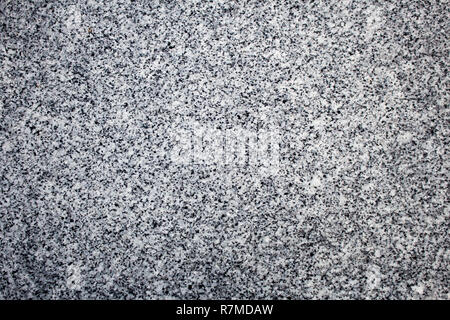Black and white granite stone surface, perfect for use in background or texture. Stock Photo