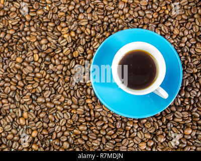 Blue espresso cup with coffee beans Stock Photo