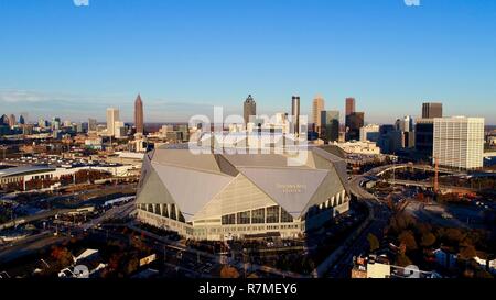 Aerial view Mercedes-Benz Stadium, site football Super Bowl LIII 2019, home the Falcons, skyline at sunset, lotus flower, in Atlanta, Georgia, USA Stock Photo