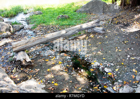 Water stream from hot springs of Pa Tueng Hot Spring at Mae Chan in Chiang Rai, Thailand Stock Photo