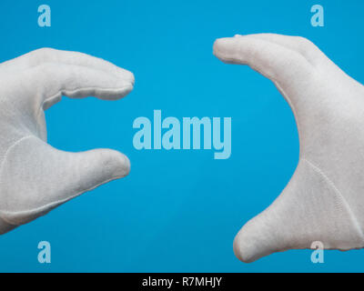 Hand showing small size between two fingers Stock Photo - Alamy