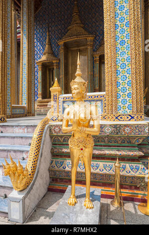 Kinnaris, half-bird, half-woman statue in front of the Prasat Phra Thep Bidon or Royal Pantheon, Wat Phra Kaeo complex Stock Photo