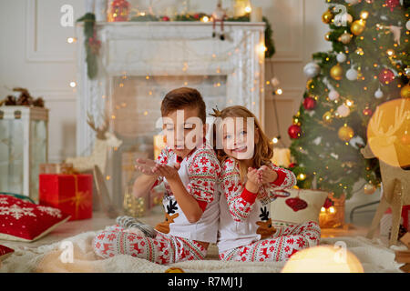 Adorable little girl and boy in Christmas time Stock Photo