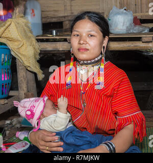 Long-necked woman with her baby, Karen tribe, Chiang Mai, Thailand Stock Photo