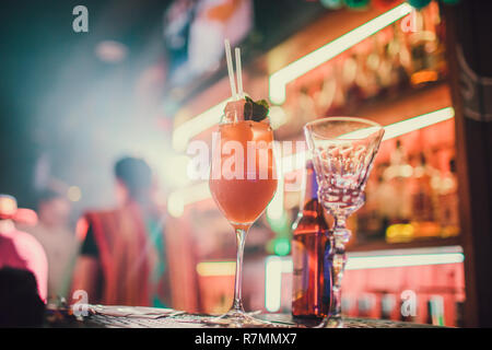 Aperol Spritz Cocktail Alcoholic beverage based on bar counter with ice cubes and oranges. Stock Photo