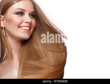 Beautiful blond girl with a perfectly smooth hair, classic make-up. Beauty face Stock Photo