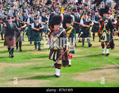 Scottish traditional music pipe major with pipe band marching down ...