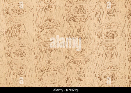Retro style floral ornament background on the old wall. Stock Photo