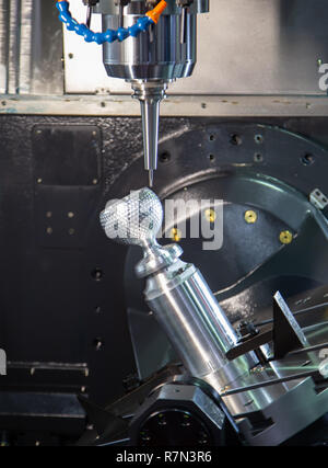 Machining steel cup on industrial milling machine Stock Photo