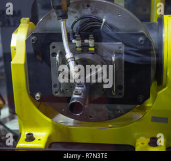 6 axis industry robotic arc machine welding nipple to pipe Stock Photo