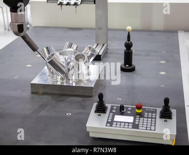CNC Coordinate Measuring Robotic Machine measuring on workpiece Stock Photo